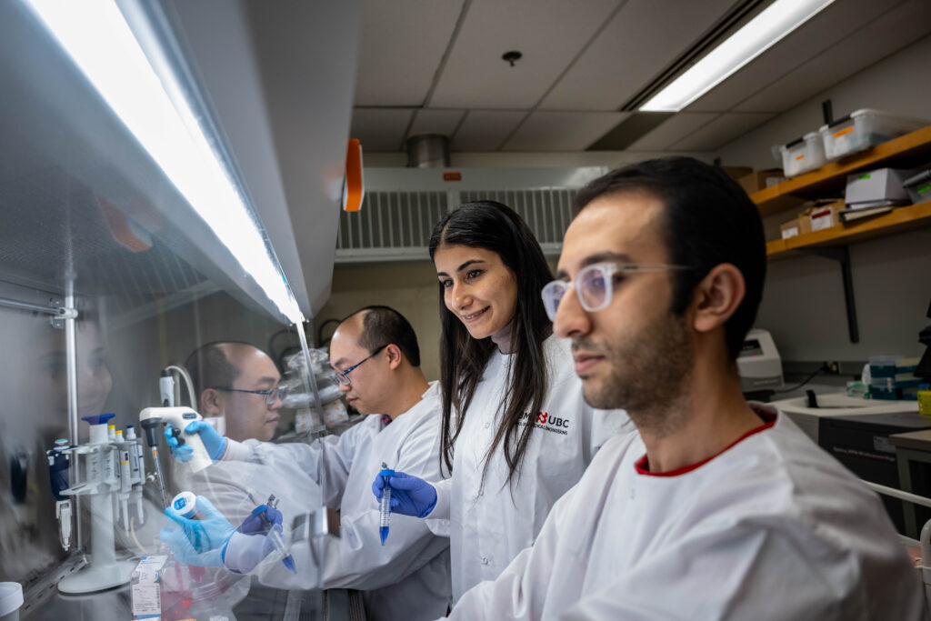 PI and students working in laboratory