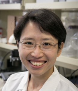 headshot of Yvonne Chen with labcoat